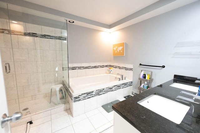 bathroom with vanity, tile patterned flooring, and plus walk in shower