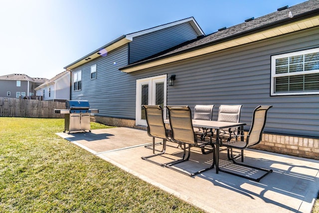 view of patio / terrace featuring french doors, outdoor dining space, grilling area, and fence