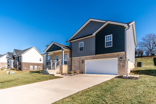 view of front of house with brick siding, central air condition unit, a front yard, a garage, and driveway