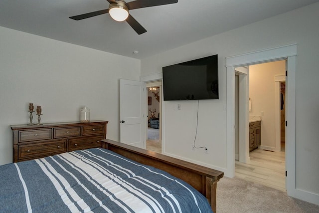 bedroom with light carpet, ceiling fan, and baseboards