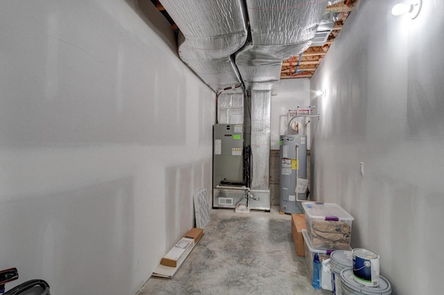 unfinished basement featuring electric water heater