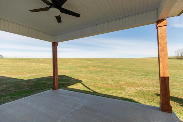 view of patio featuring a rural view and ceiling fan