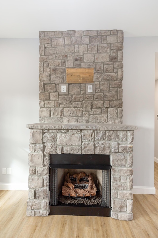 room details featuring hardwood / wood-style flooring and a fireplace