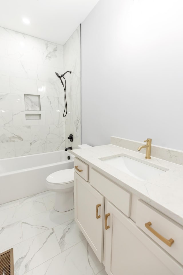 full bathroom with tiled shower / bath combo, vanity, and toilet