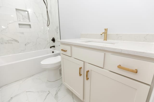 full bathroom featuring vanity, tiled shower / bath combo, and toilet