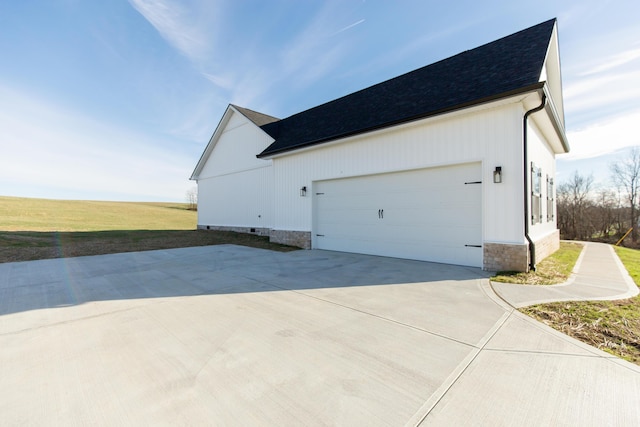 view of side of property with a garage