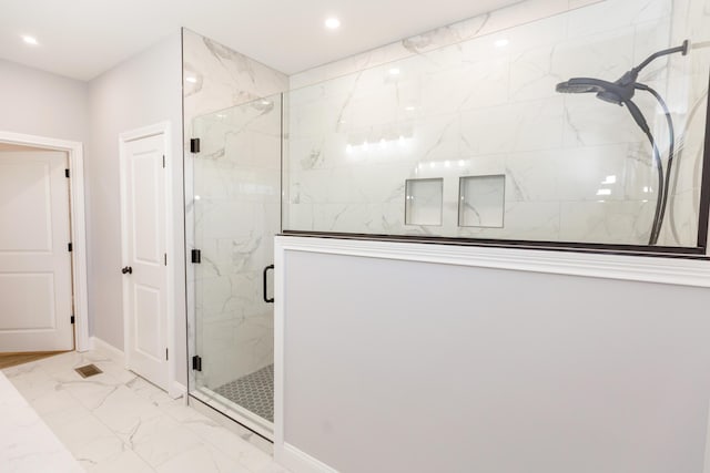 bathroom with an enclosed shower