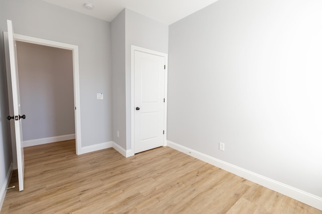 unfurnished bedroom with light hardwood / wood-style floors