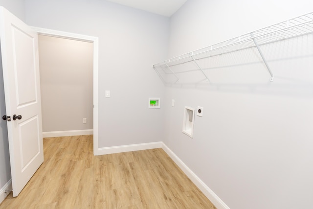 laundry area with washer hookup, hookup for an electric dryer, and light hardwood / wood-style flooring