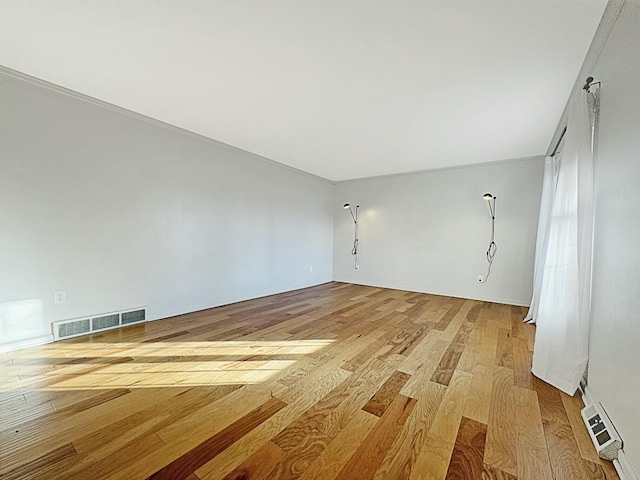 unfurnished room featuring light hardwood / wood-style floors