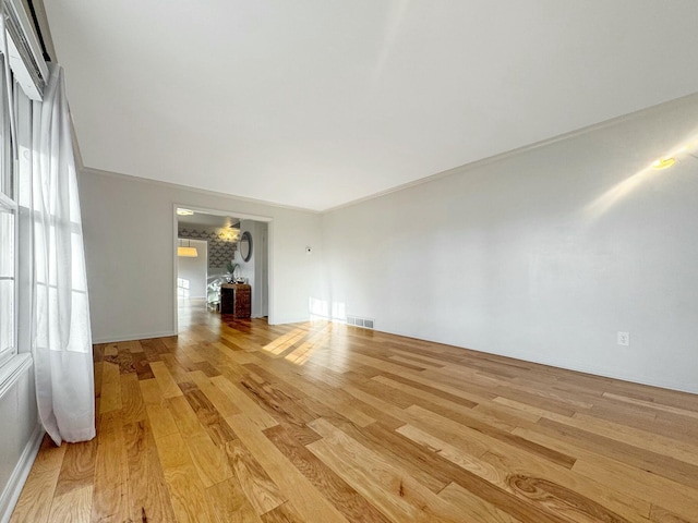 unfurnished room featuring light hardwood / wood-style flooring