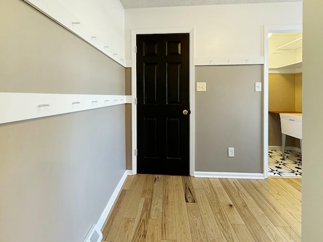 entryway with light wood-type flooring