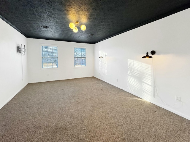 unfurnished room featuring carpet and a textured ceiling