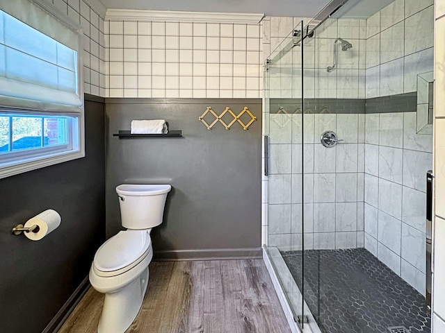 bathroom with toilet, walk in shower, and hardwood / wood-style floors