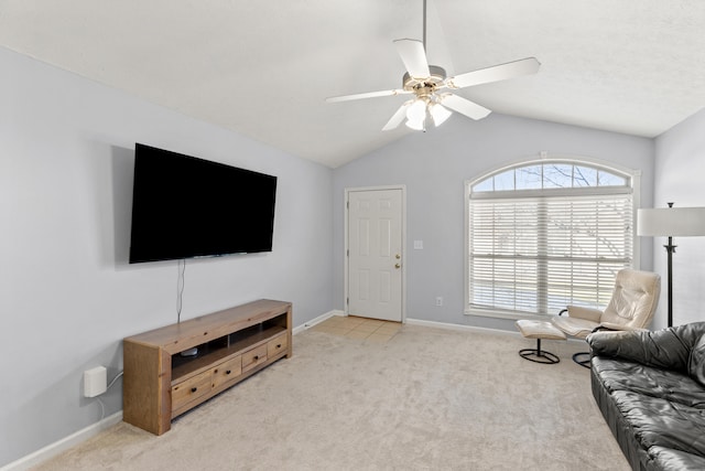 carpeted living room featuring vaulted ceiling and ceiling fan