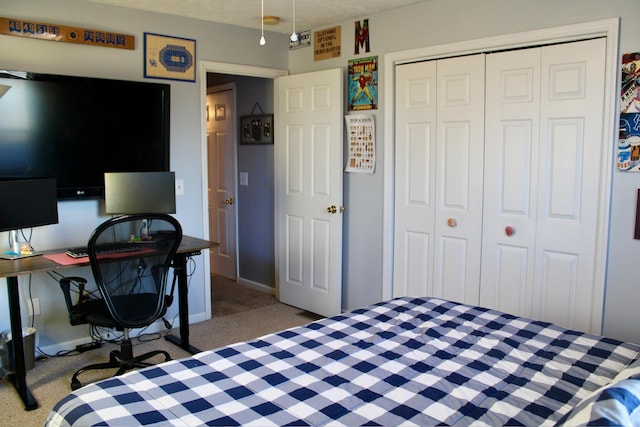 bedroom featuring light colored carpet and a closet