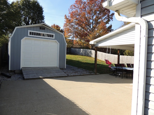 garage featuring a lawn