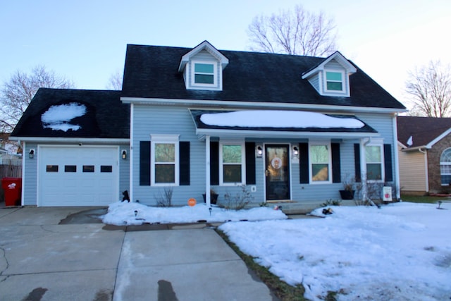 new england style home featuring a garage and covered porch