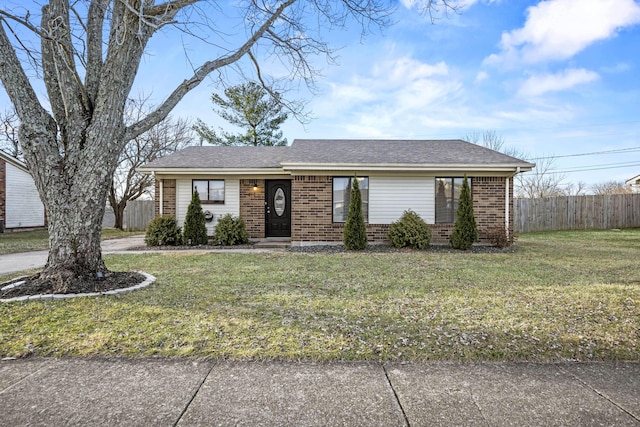 ranch-style home with a front lawn