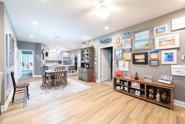 dining area featuring light hardwood / wood-style floors and ceiling fan