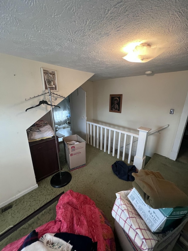 interior space with carpet and a textured ceiling