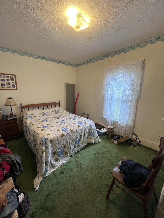 carpeted bedroom with a textured ceiling