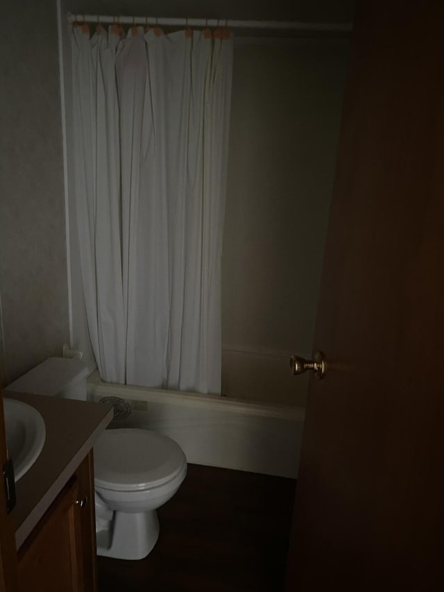 full bathroom featuring vanity, toilet, and shower / bath combo with shower curtain