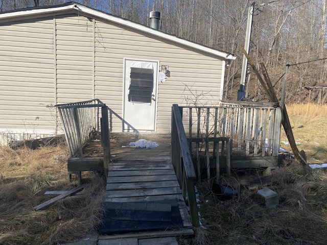 entrance to property with a wooden deck