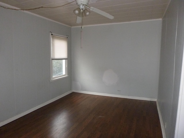 unfurnished room with dark hardwood / wood-style flooring, ornamental molding, and ceiling fan