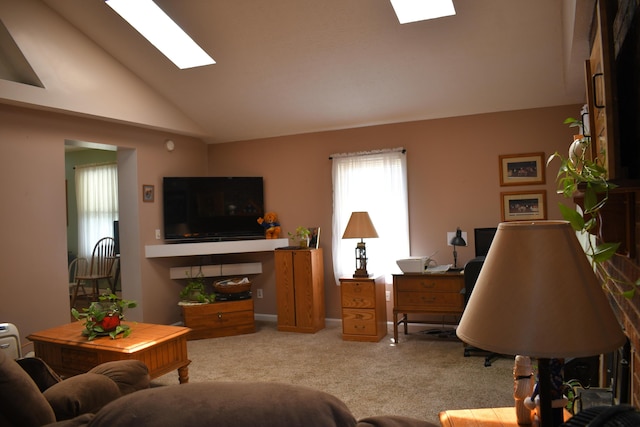 living room with vaulted ceiling with skylight and light carpet