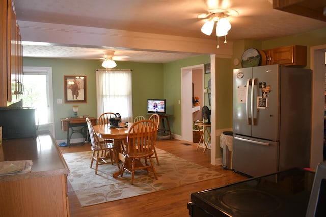 dining area featuring ceiling fan and light hardwood / wood-style flooring