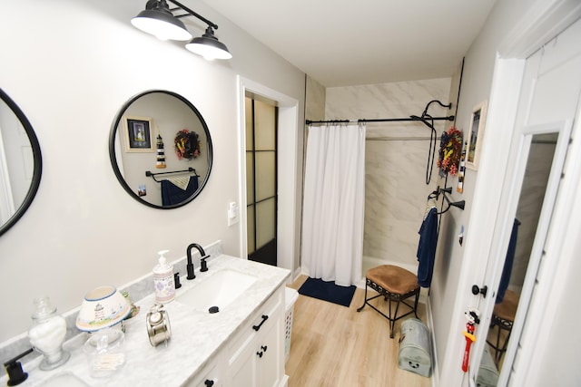 bathroom featuring vanity, hardwood / wood-style floors, and shower / bath combo