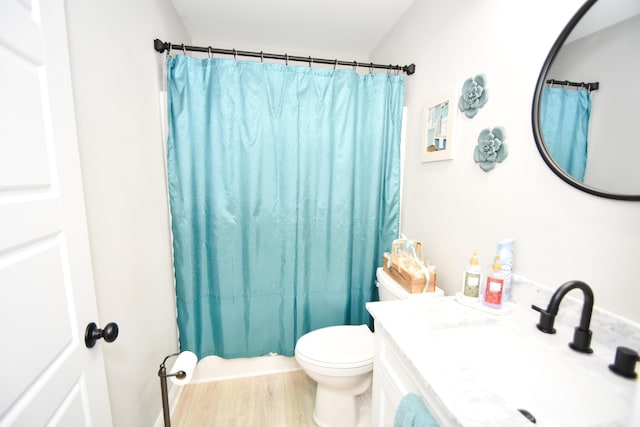 full bathroom with vanity, wood-type flooring, toilet, and shower / tub combo with curtain