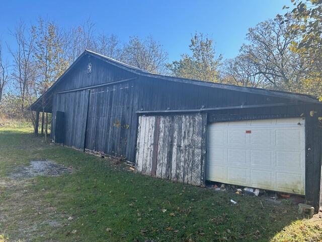 garage with a lawn