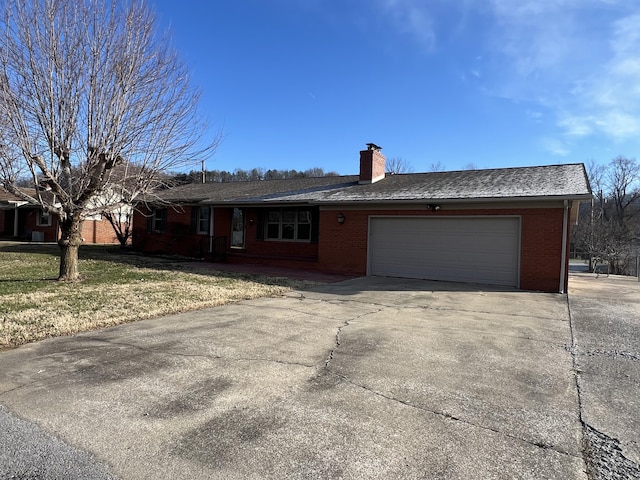 ranch-style house featuring a garage