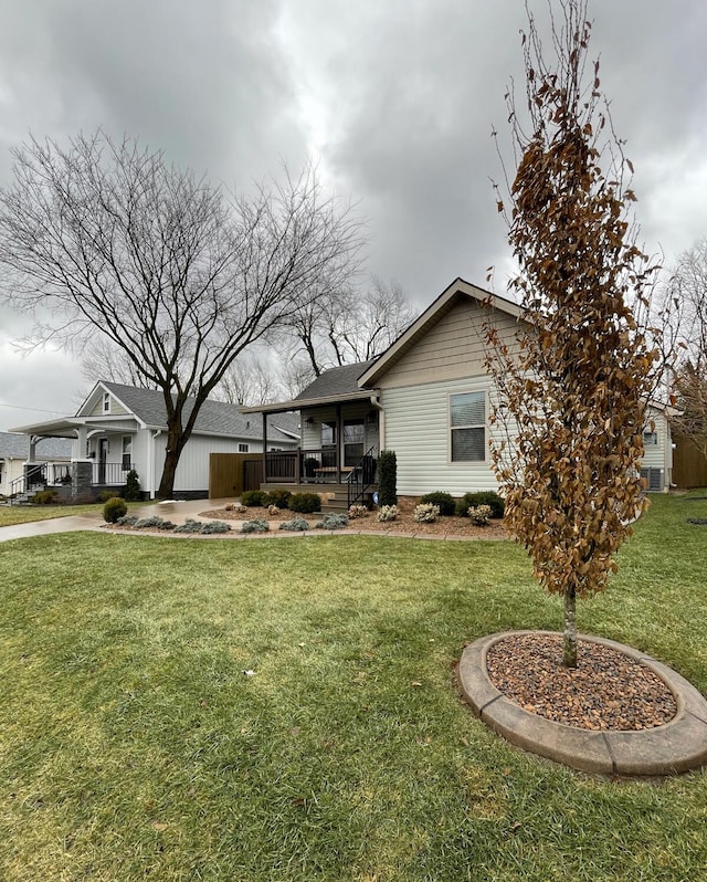 exterior space featuring a porch and a front lawn