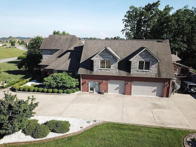 view of front of property with a garage and a front lawn