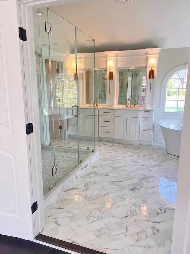 bathroom featuring vanity and plus walk in shower