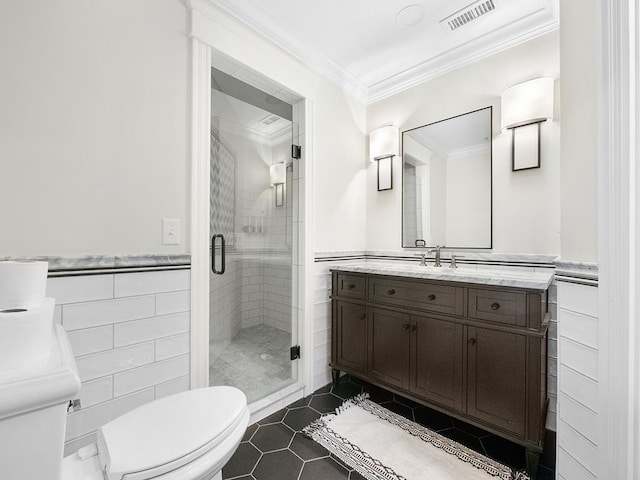 bathroom featuring tile walls, vanity, ornamental molding, toilet, and walk in shower