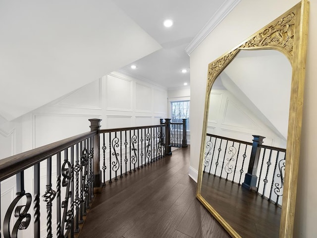 hall with crown molding and dark wood-type flooring