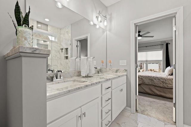 bathroom featuring vanity, ceiling fan, and walk in shower