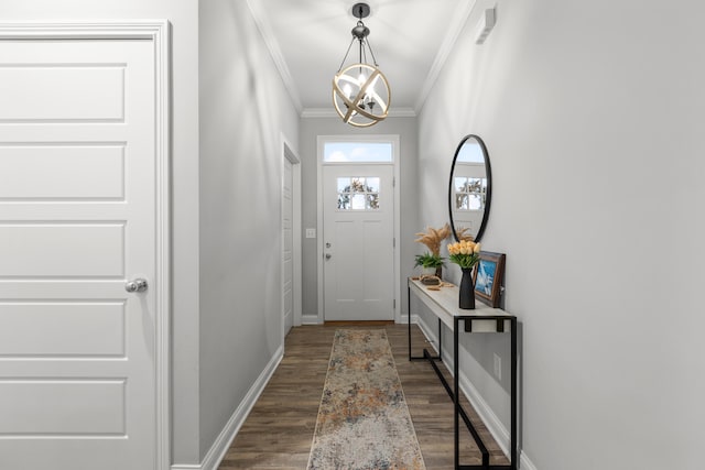 doorway with ornamental molding, a chandelier, and dark hardwood / wood-style flooring