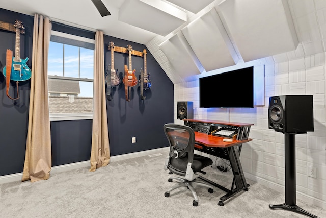 carpeted office with lofted ceiling