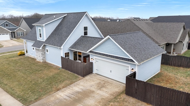 exterior space with a garage and a front lawn