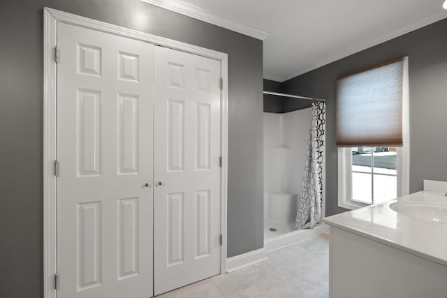 bathroom featuring vanity, tile patterned flooring, crown molding, and a shower with shower curtain