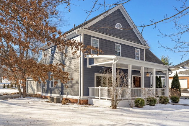 view of front of property with a porch and central AC unit