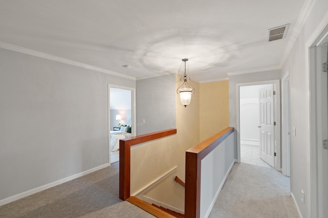 hall with light carpet and ornamental molding