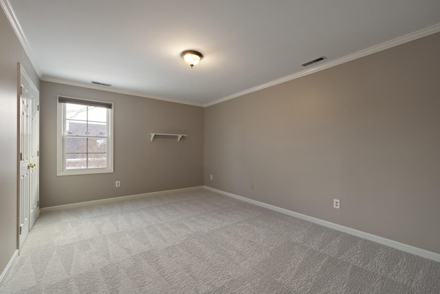 carpeted empty room with crown molding