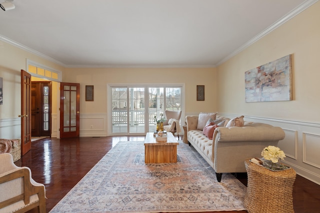 living room featuring ornamental molding and dark hardwood / wood-style flooring