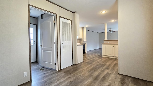 hallway with dark hardwood / wood-style flooring